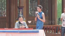 World record holder spinning 10 bowls on chopsticks at the same time