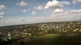 Camera-mounted RC plane crashes into field and is picked up by cows