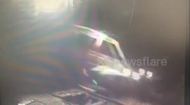 Train crashes into minibus stopped on rails