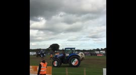 Farmers in tractors play 'football' in Ireland