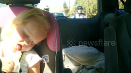 Sleepy toddler tries to eat a popsicle