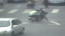Man drags police officer on motorcycle for 50 metres