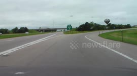 Dual semis running red light caught on dashcam.