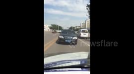 Car drives backwards on road in China