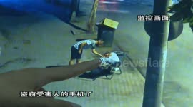 Sneaky man caught on camera appearing to steal woman's phone
