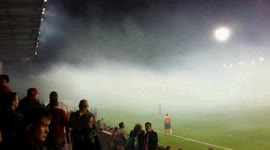 submit match supporters quietly with Bengal lights . Moeskroen - Club Brugge