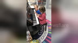Newsflare Edit - 3 year Old twins playing piano at Manchester Victoria train station. Please like and share.