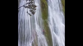Crazy Guy jumps / dives into waterfall