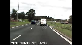 Dash cam footage of van jumping onto central reservation