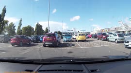 Oblivious driver takes up two spaces in parking fail
