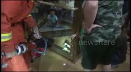 Firefighters rescue boy with arm stuck in revolving door