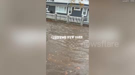 Video shows vehicles driving through flooded streets in Queens