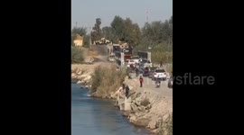 Syria: An SDF fighter mobilized at the land bridge over the Euphrates River in the city of Deir ez-Zor after residents on the opposite side of the bridge demonstrated against the SDF and its presence in areas east of the Euphrates