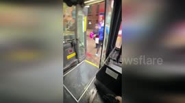 US: Woman Boards Bus Through Flooded Street In Brooklyn Downpour