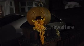 A pumpkin vomits late into the night of Halloween