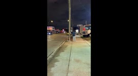 Inflatable chicken mascot rides electric unicycle in Houston, Texas, USA