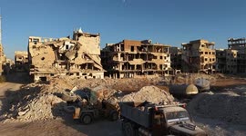 War-damaged Damascus building collapses years after regime bombings