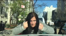 Woman hits car bonnet repeatedly in shocking road rage display