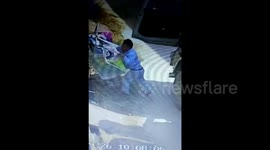 Lorry driver, pretending to repair tyres, appears to steal underwear from nearby washing line