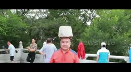 Man walks 3000 metres with 80-gram stone on head