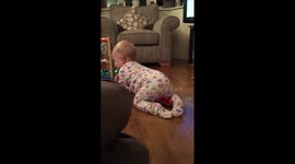Baby stops door with nose