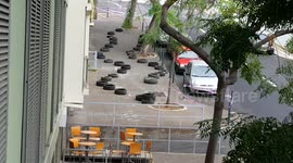 Downhill Biker almost goes against fence