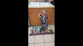 Two year old Zayden born hearing impared singing Holy by Florida Georgia Line .