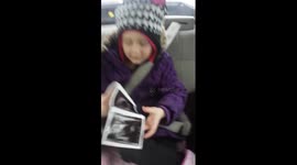 Girl reacts to finding out she's going to be a big sister in the best way possible