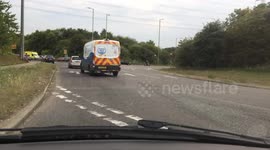Nasty crash narrowly avoided as van mounts curb