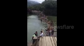 Wooden bridge collapses in tourist attraction injuring eight