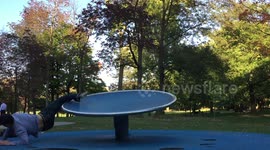Father receives involuntary lesson on centrifugal force