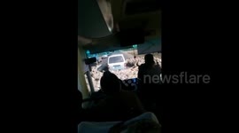 Sheep encircle minibus in China like churning storm cloud