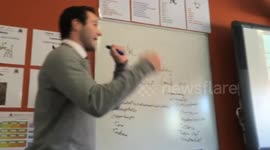 Rapping teacher performs for students during maths class