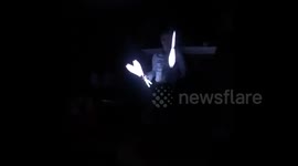 Dad-to-be juggles LED light sticks to reveal baby gender