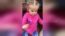 Cute toddler tries ice cream for the first time