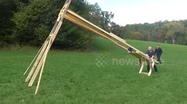 German man creates giant slingshot to send bowling ball 100 metres