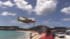 DHL propeller plane approaching St Maarten Airport
