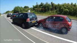 Car escapes nasty crash in tyre-screeching near-miss