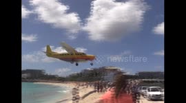 Propeller plane approaching the iconic St Maarten Airport