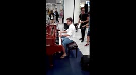 Musician impresses airport passengers with incredible public piano display