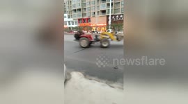 Out-of-control, driverless forklift truck does big doughnuts on road