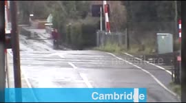Cyclist caught in railway crossing gates