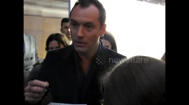 Jude Law signs autographs for fans in London