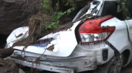 Huge stones hit car in residential area because of landslide
