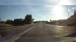 Dashcam: Driver pulls out on national road