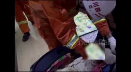 Baby, one, gets his head stuck in baby carriage