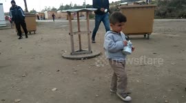 Child in Grande Synthe refugee migrant camp in France