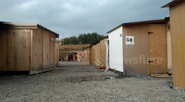 Walking through Grande Synthe refugee migrant camp in Dunkirk, France