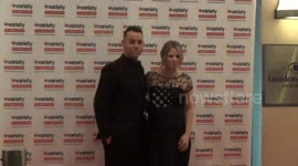 Kimberley Walsh clutches her bump at Variety Showbiz Awards
