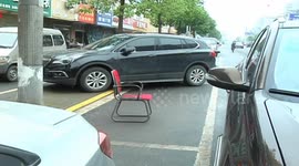 Cheeky drivers build makeshift roadblocks to reserve parking spaces